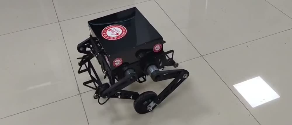 Wheel-legged inspection robot with linkage legs and hub motors on a factory floor